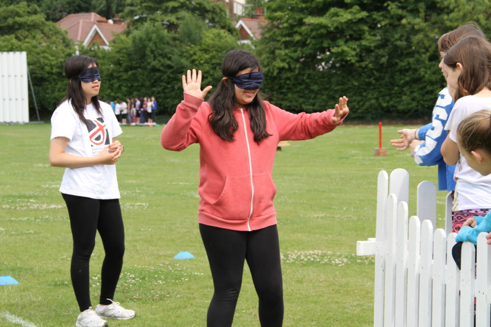 Children blindfolded activity challenge
