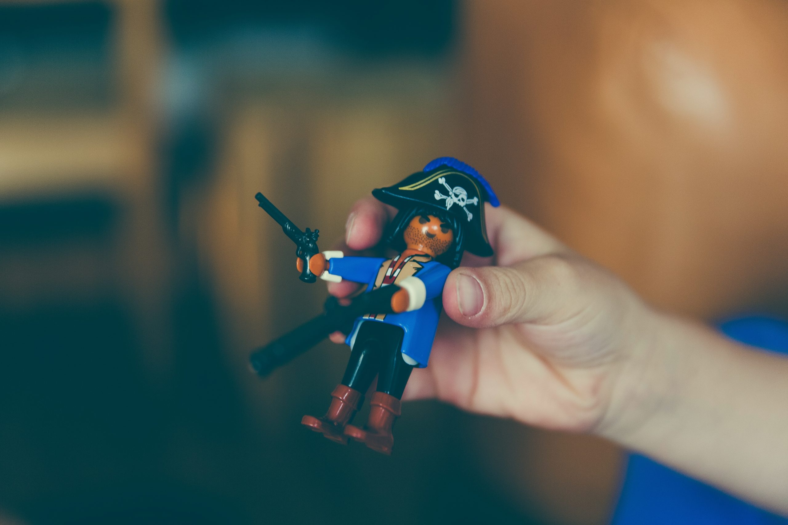 Hand holding a Lego pirate